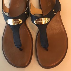 MK plate thong sandals